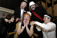 Anne King surrounded by suspicious characters